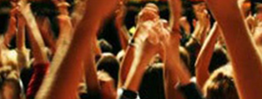 Concert Goers with hands up