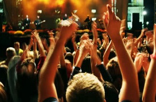 Concert Goers with hands up