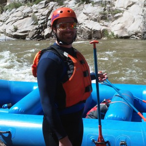 Guy smiling in whitewater rafting gear