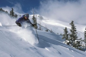 Guy skiing powder