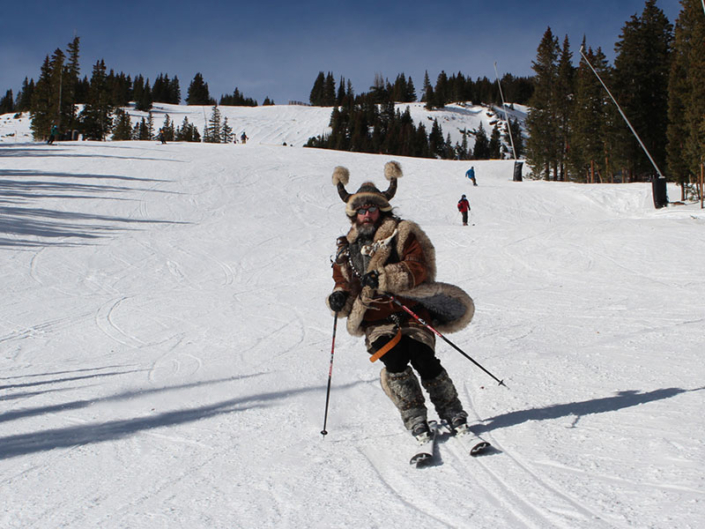 Man Dressed in Viking Outfit Skiing