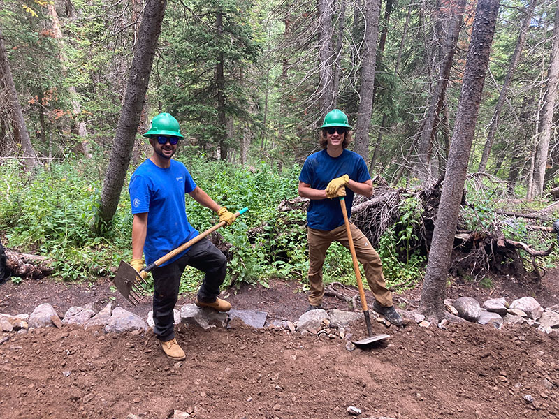 Two people volunteering on trail work in Breckenridge